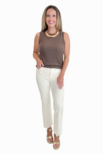 Front view of woman wearing Swagger Boutique’s Kelsey Ankle Flare Jeans In Ecru by Kut from the Kloth with top against white studio background.