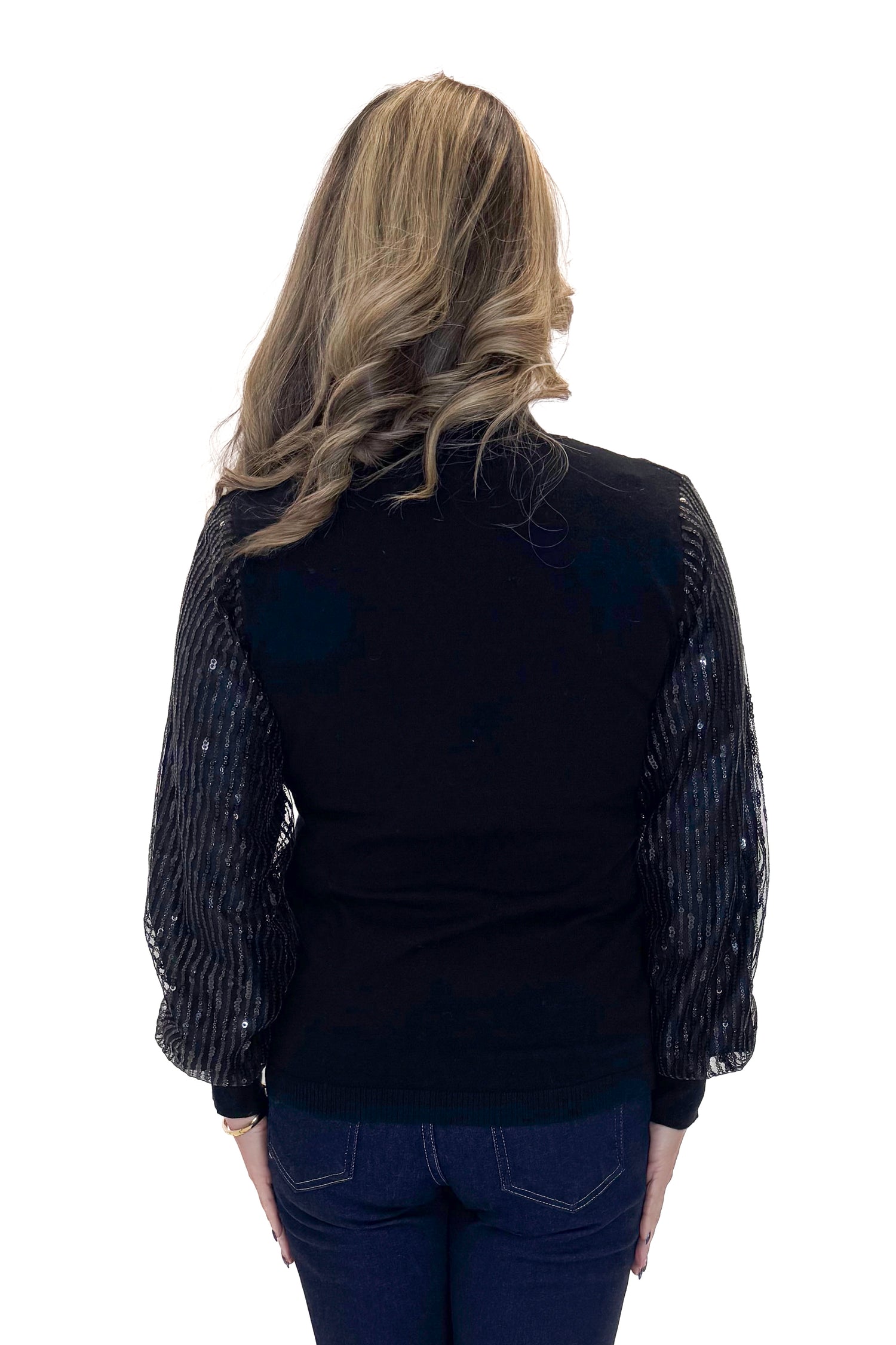 Back view of woman wearing Black Sequined Sleeve Turtleneck Sweater with jeans against white studio background.