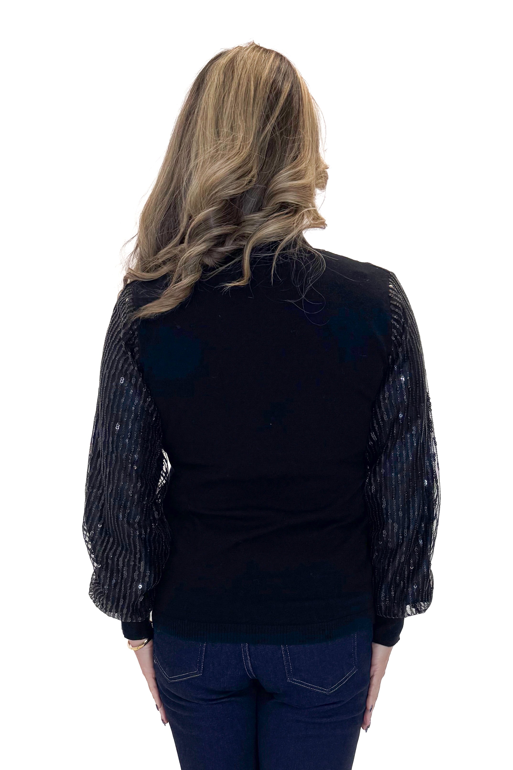 Back view of woman wearing Black Sequined Sleeve Turtleneck Sweater with jeans against white studio background.