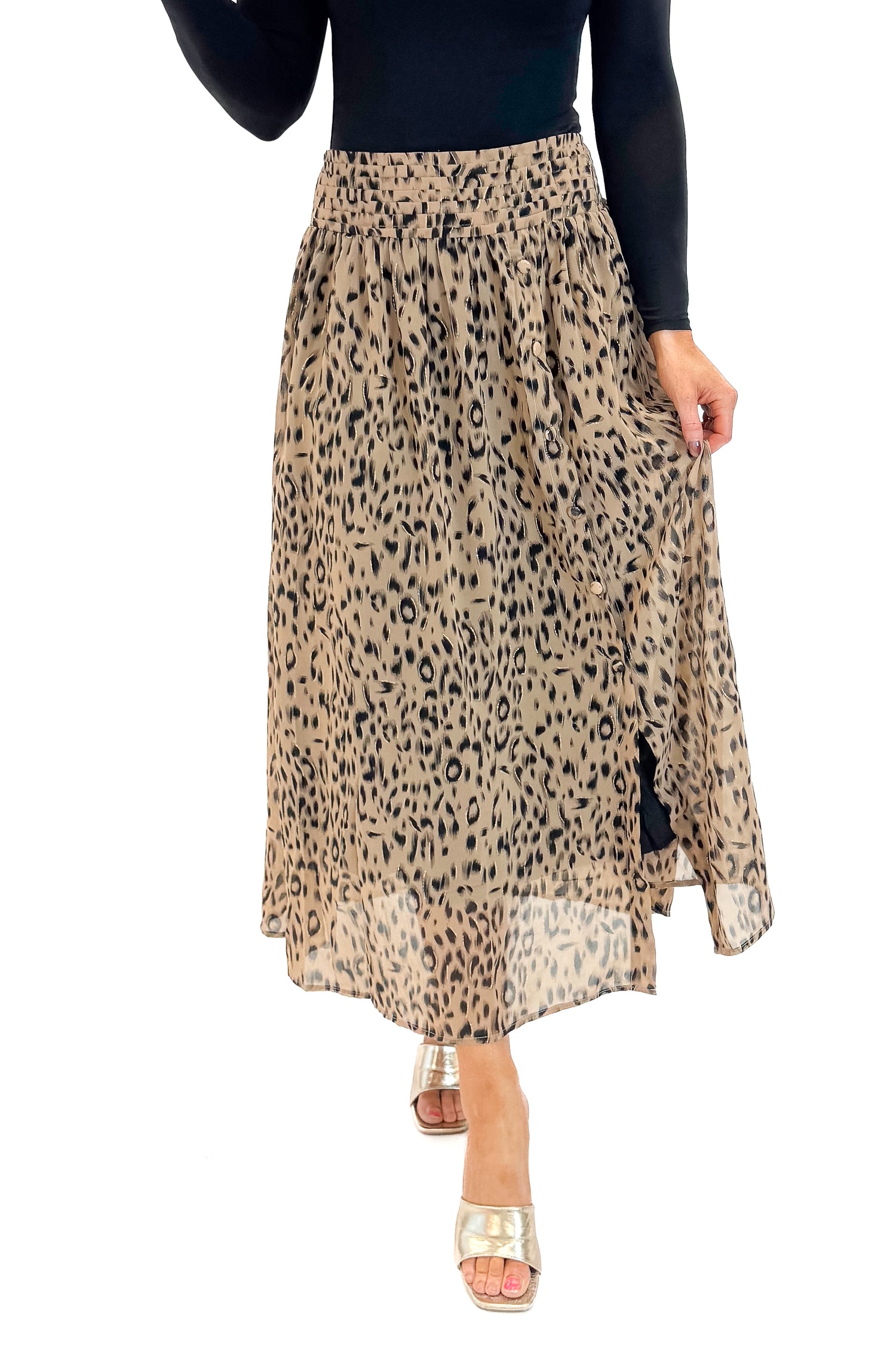 Front view of woman wearing black top with Beige Leopard Button Detail Skirt against white studio background.