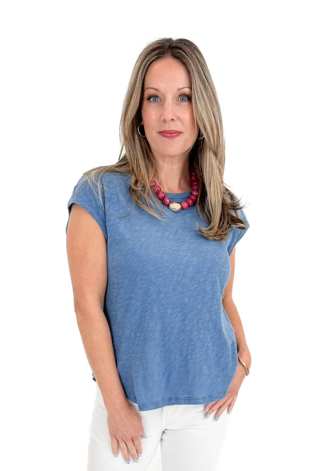 Front view of woman wearing Lake Blue Sol Slub Tank by Z Supply with jeans against white studio background.