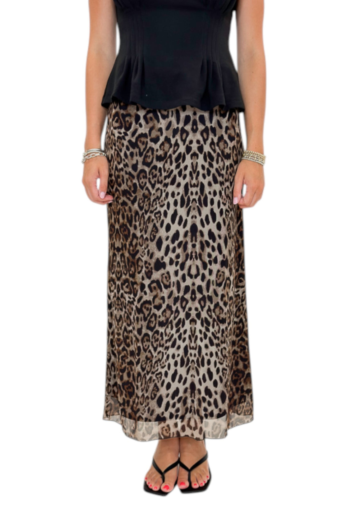 Front view of woman wearing Swagger Boutique’s Leopard Mesh Skirt with Black Mock Neck Pleat Waist Top by Entro against white studio background.