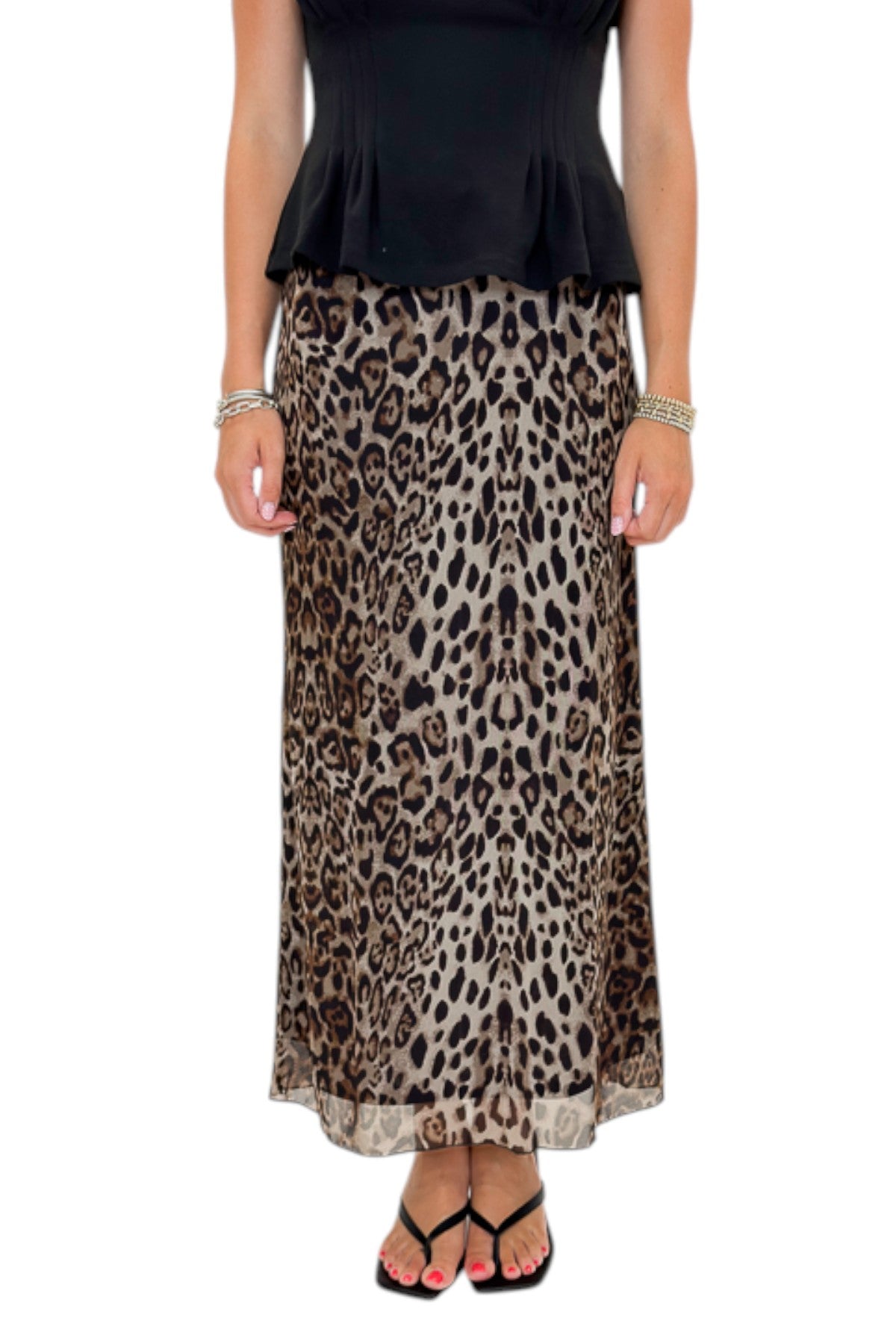 Front view of woman wearing Swagger Boutique’s Leopard Mesh Skirt with Black Mock Neck Pleat Waist Top by Entro against white studio background.
