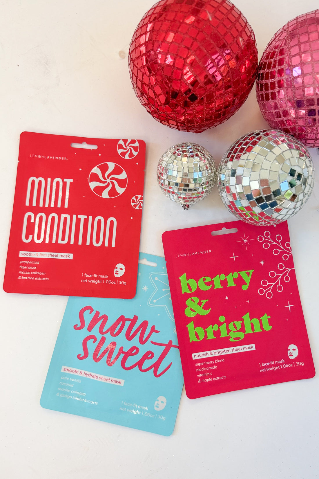 Let It Glow Holiday Face Mask against holiday background.