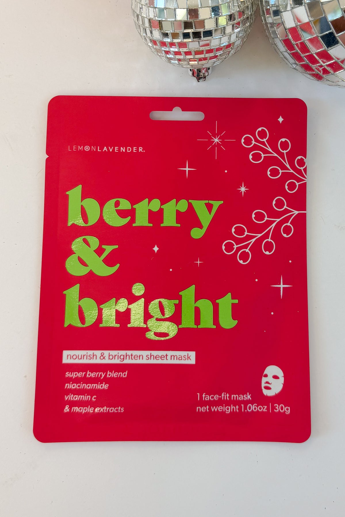 Let It Glow Holiday Face Mask against holiday background-Berry &amp; Bright