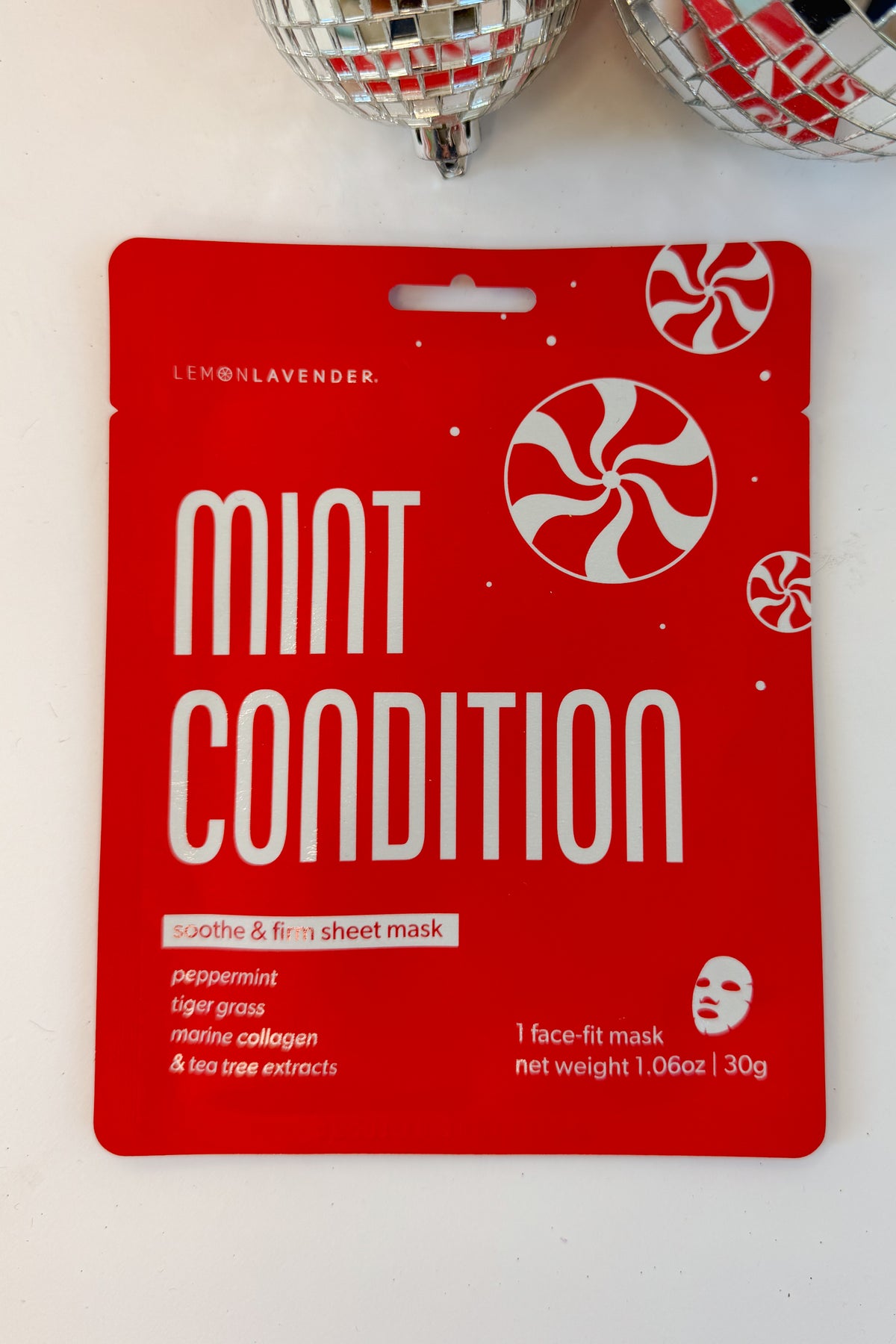 Let It Glow Holiday Face Mask against holiday background-Mint Condition