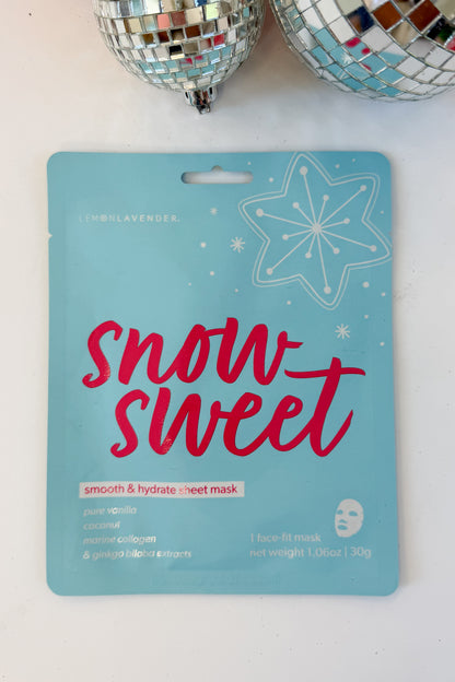Let It Glow Holiday Face Mask against holiday background-Snow Sweet