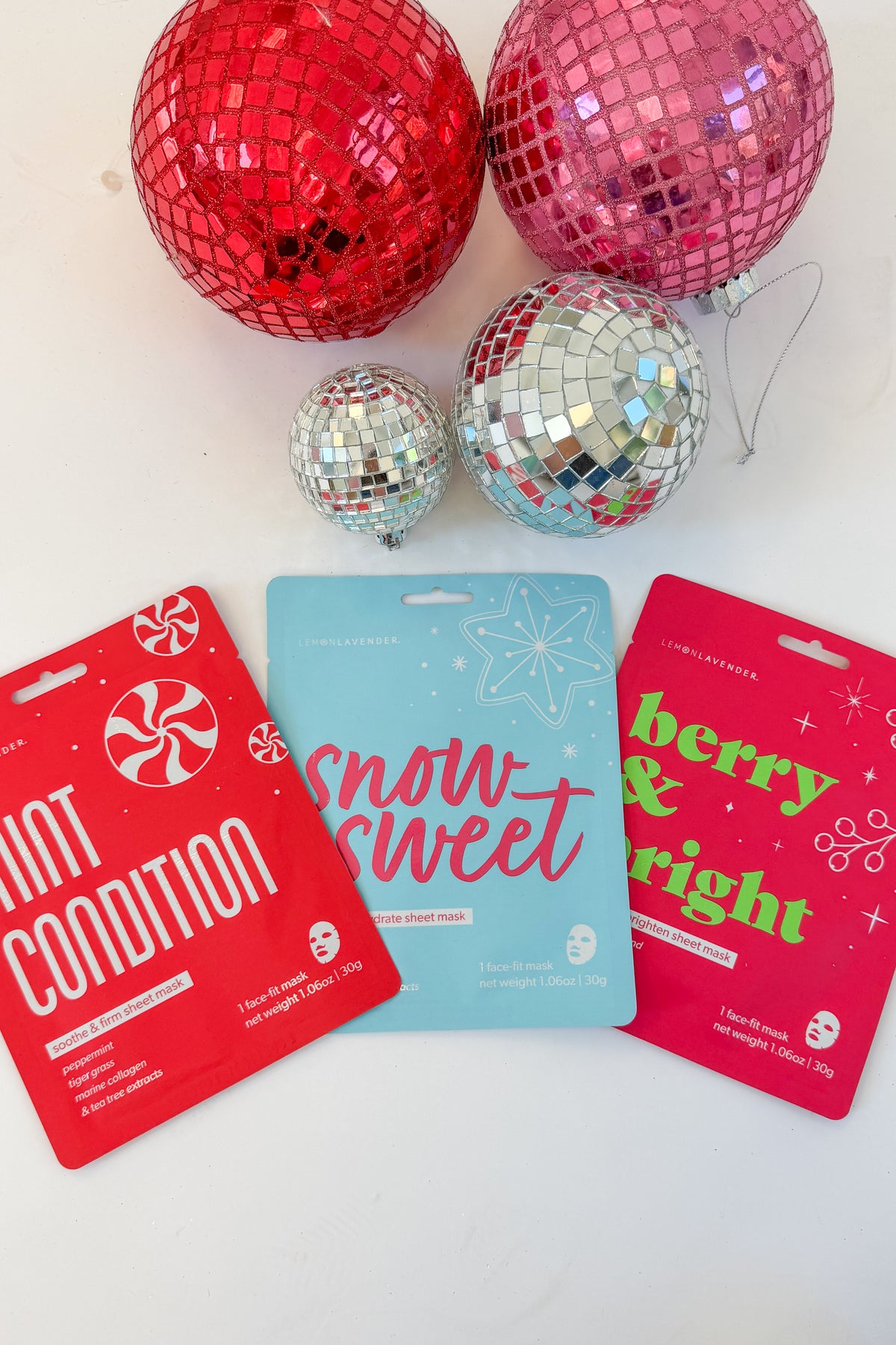 Let It Glow Holiday Face Masks against holiday background.