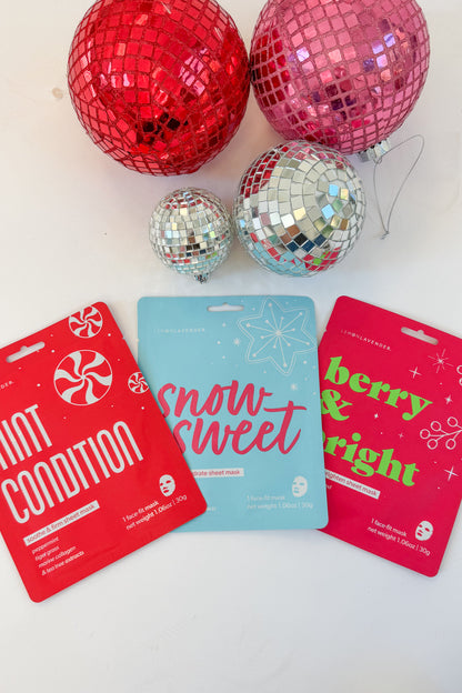 Let It Glow Holiday Face Masks against holiday background.