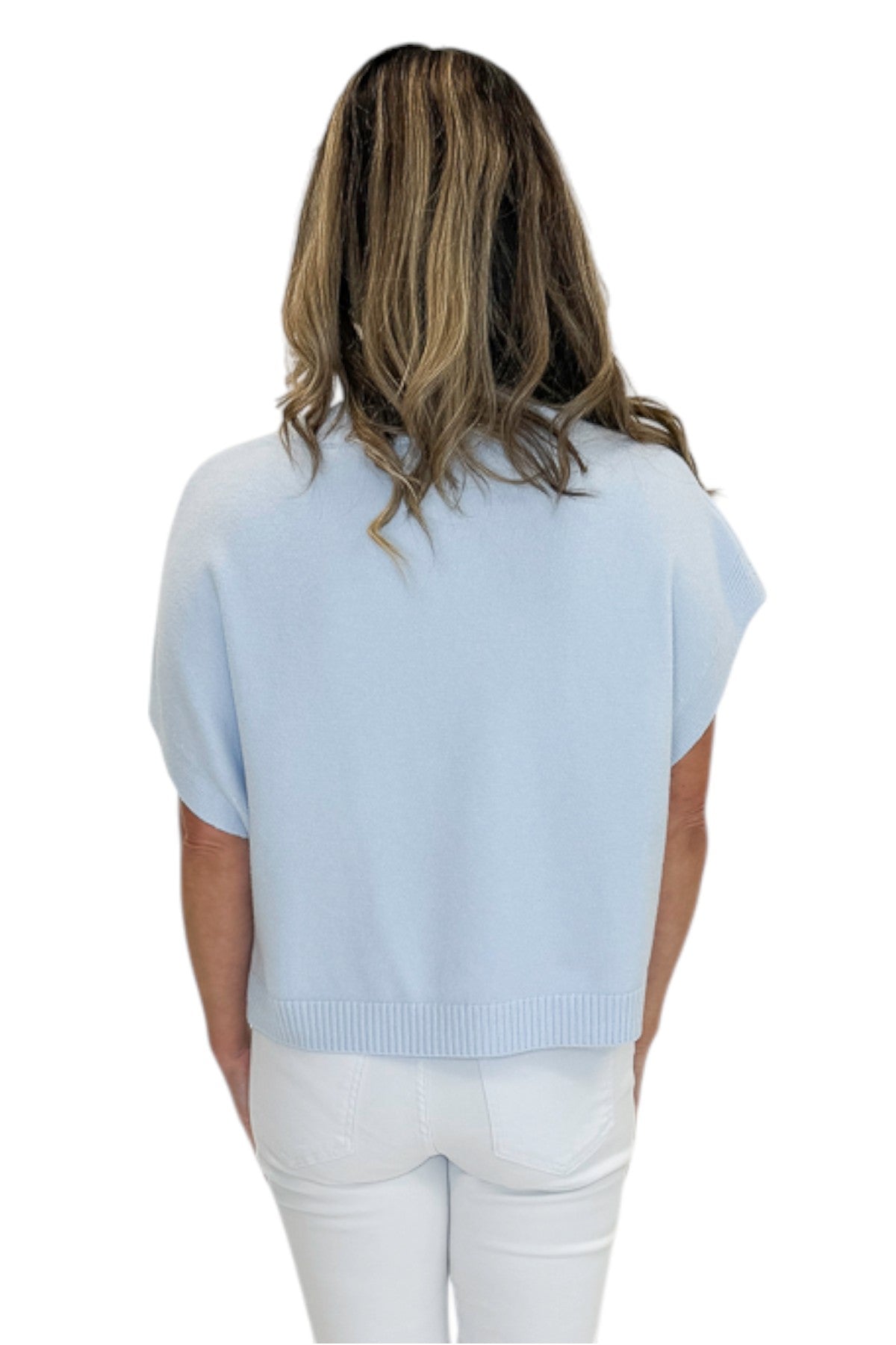 Back view of woman wearing Swagger Boutique’s Light Blue Light Weight Short Sleeve Sweater with jeans against white studio background.