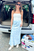 Front view of woman wearing Swagger Boutique’s Light Blue & White Polka Dot Satin Skirt with white top at a football tailgate.