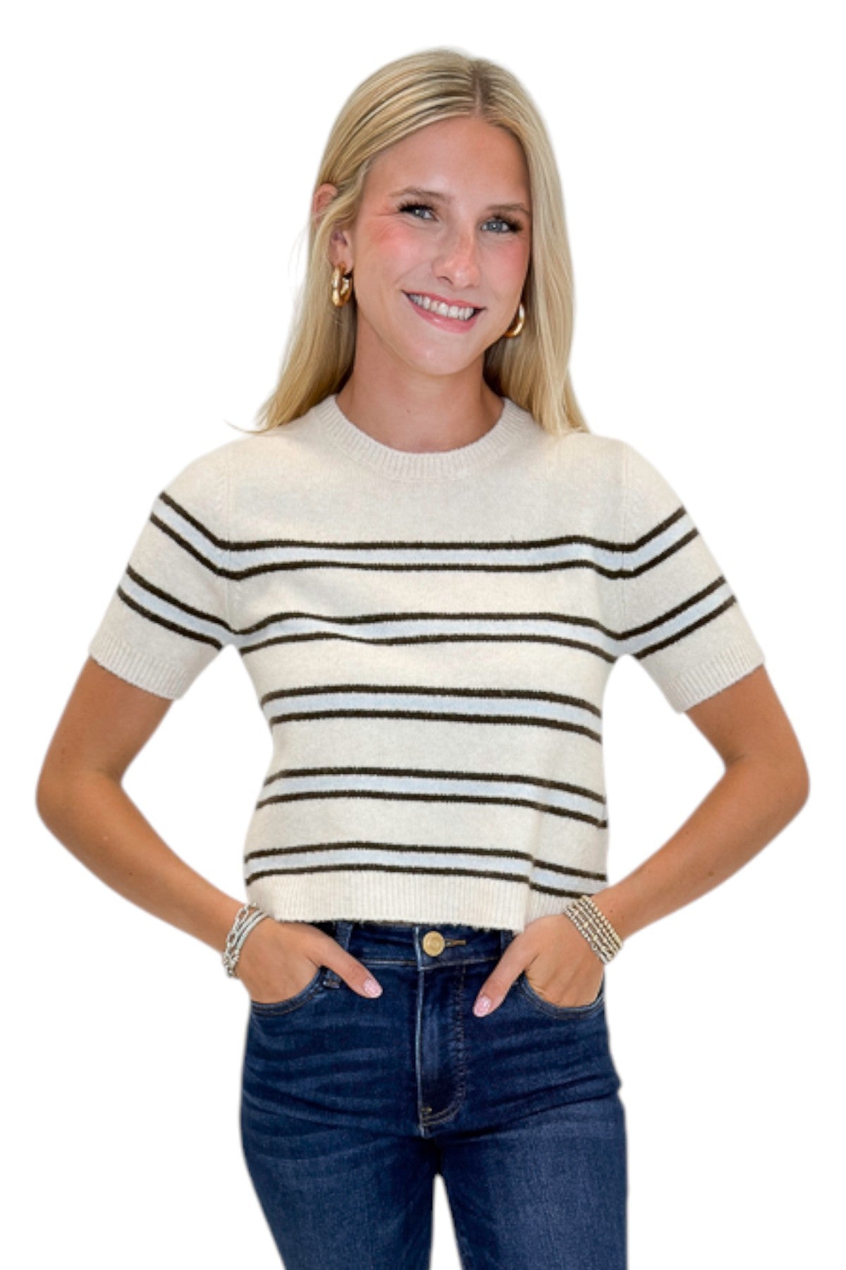 Front view of woman wearing Swagger Boutique’s Light Oatmeal Heather Gatewood Stripe Sweater by Z Supply with jeans against white studio background.