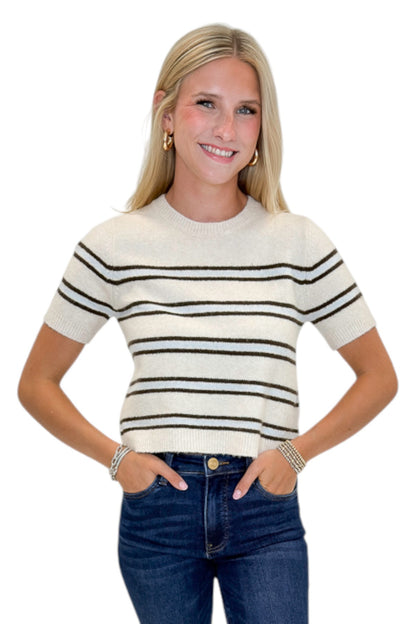 Front view of woman wearing Swagger Boutique’s Light Oatmeal Heather Gatewood Stripe Sweater by Z Supply with jeans against white studio background.