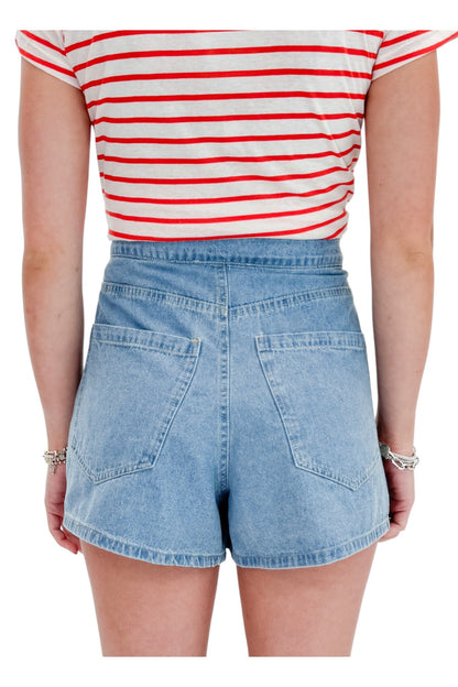 Back detail view of woman wearing Swagger Boutique’s Lychee Junie Striped Tee by Z Supply with Light Wash Denim Wrap Skort against white studio background.