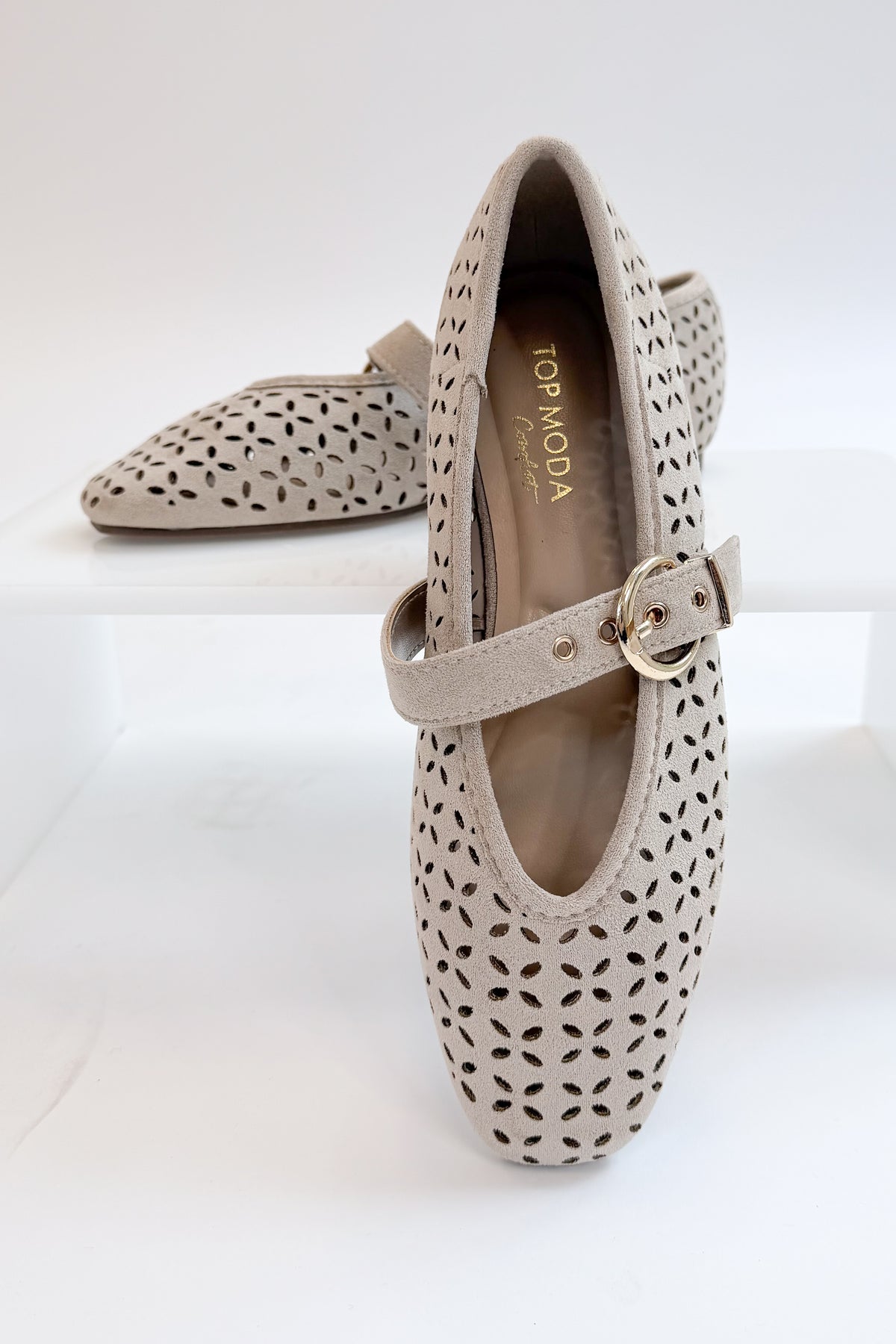 Linda- Sand Suede Flats against white studio background. 