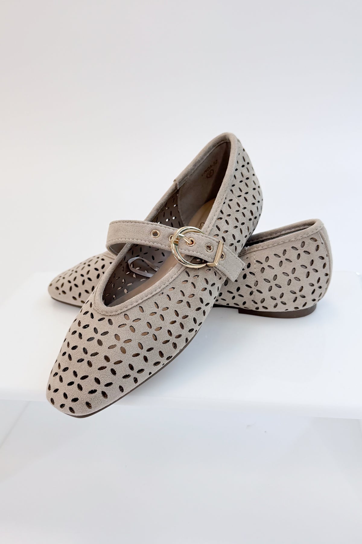 Linda- Sand Suede Flats against white studio background. 
