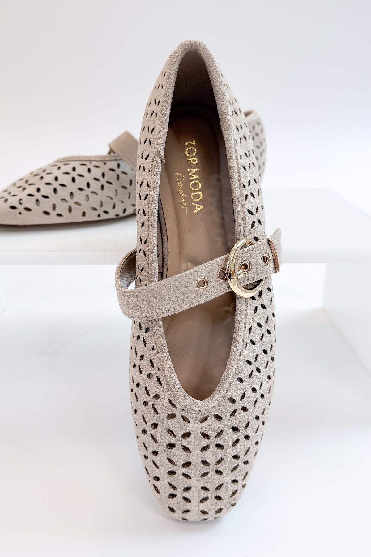 Linda- Sand Suede Flats against white studio background. 
