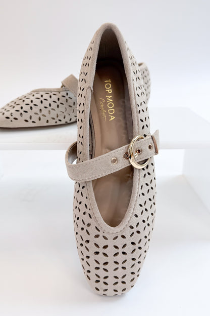 Linda- Sand Suede Flats against white studio background. 