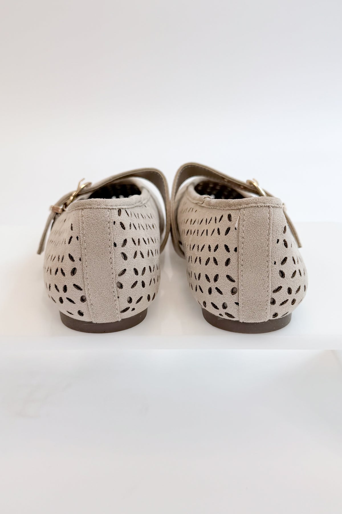Linda- Sand Suede Flats against white studio background back view.