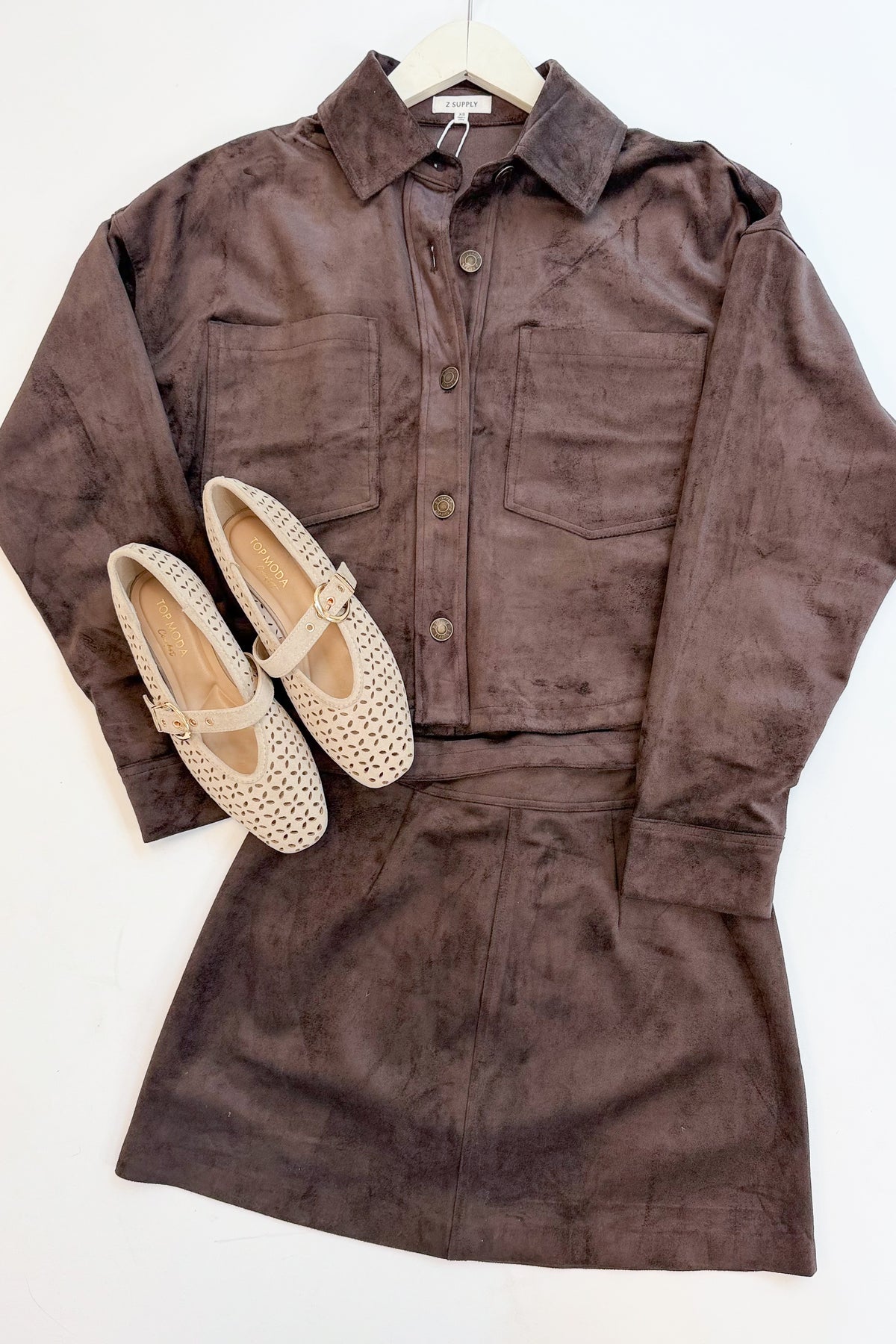 Linda- Sand Suede Flats against white studio background with Z Supply brown set. 