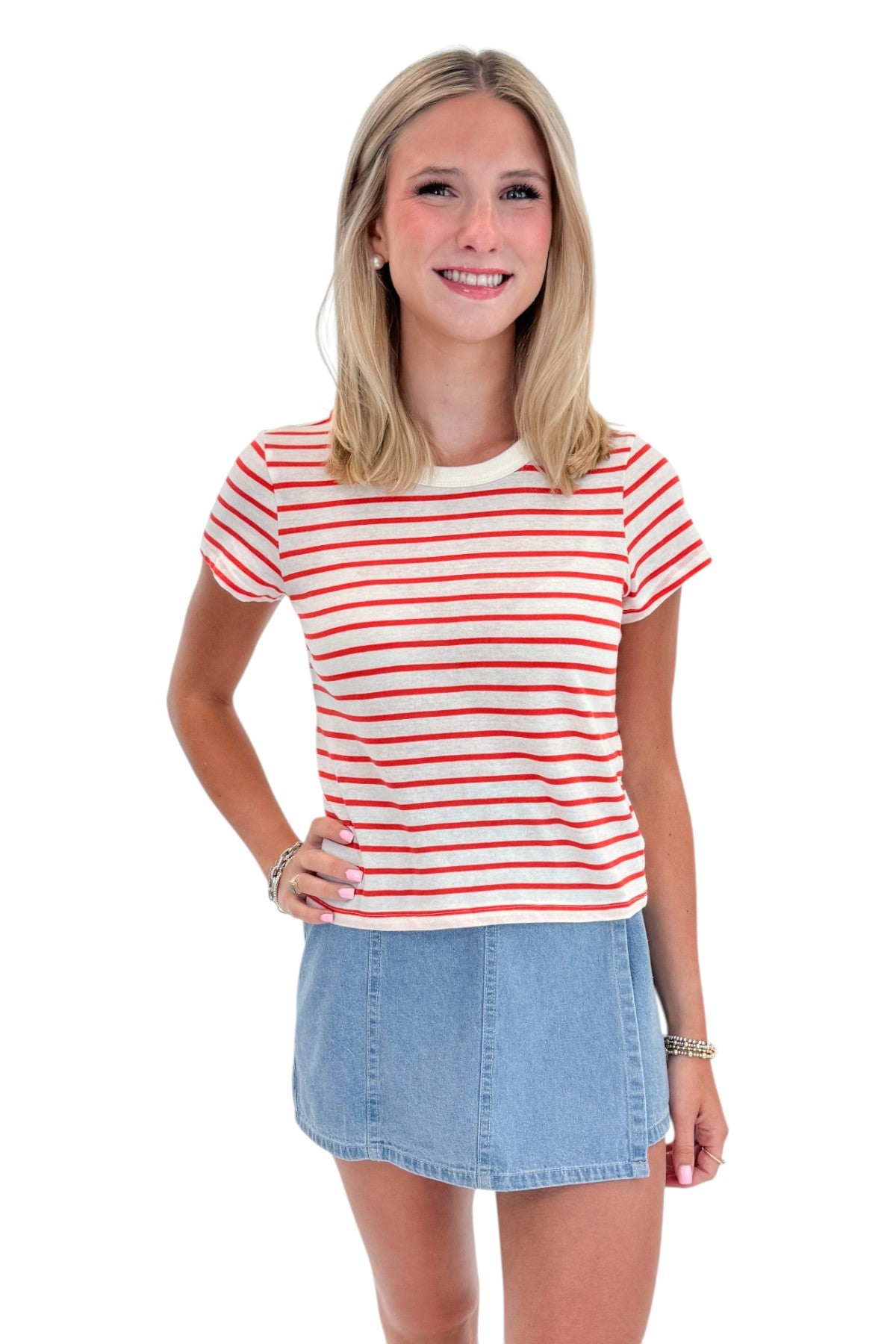 Front view of woman wearing Swagger Boutique’s Lychee Junie Striped Tee by Z Supply with Light Wash Denim Wrap Skort against white studio background.