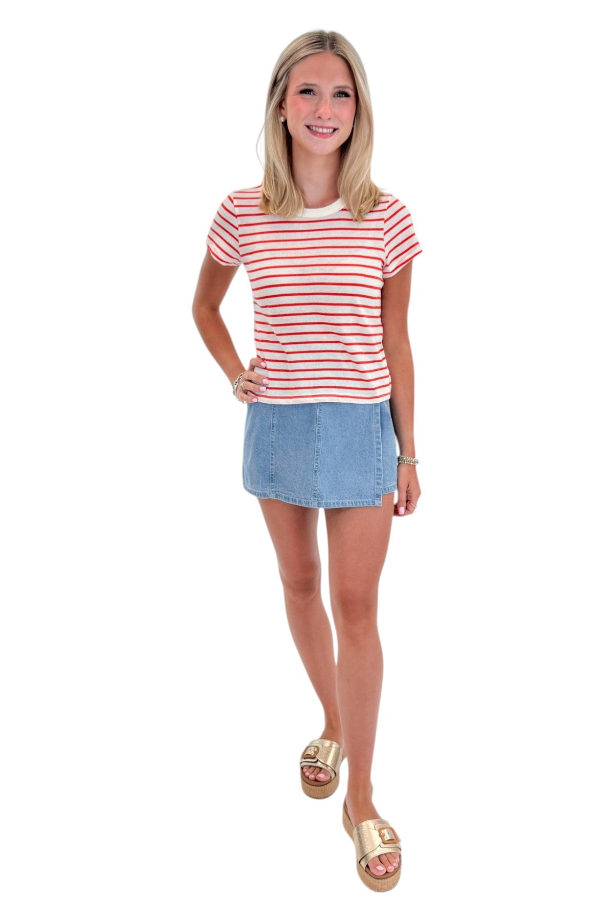 Front view of woman wearing Swagger Boutique’s Lychee Junie Striped Tee by Z Supply with Light Wash Denim Wrap Skort against white studio background.