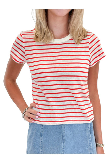 Front detail view of woman wearing Swagger Boutique’s Lychee Junie Striped Tee by Z Supply with Light Wash Denim Wrap Skort against white studio background.