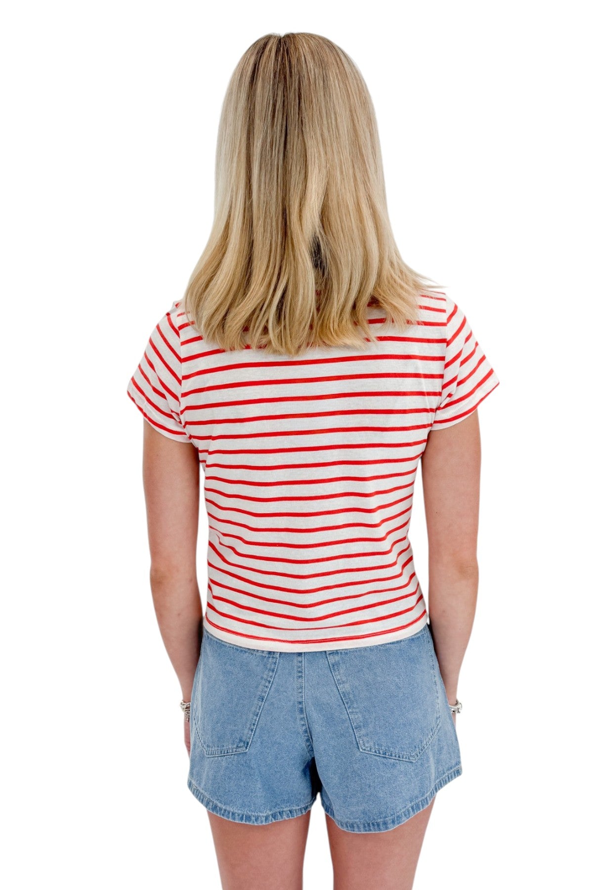 Back view of woman wearing Swagger Boutique’s Lychee Junie Striped Tee by Z Supply with Light Wash Denim Wrap Skort against white studio background.