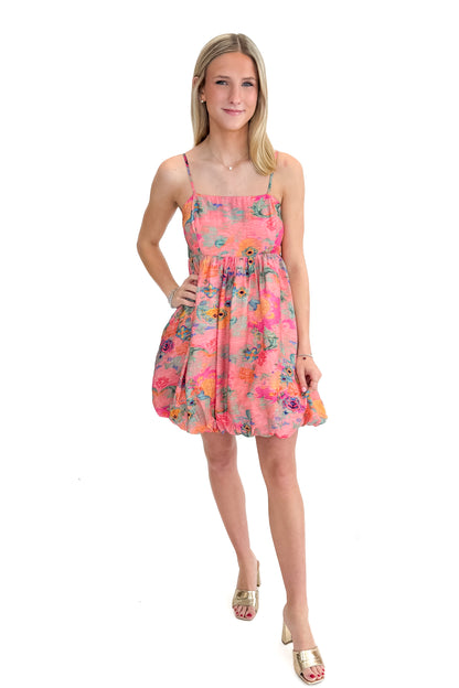 Front view of woman wearing Pink &amp; Multi Printed Bubble Hem Tank Dress against white studio background.