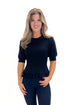 Front view of woman wearing Black Ribbed Trim Detail Top with jeans against white studio background.