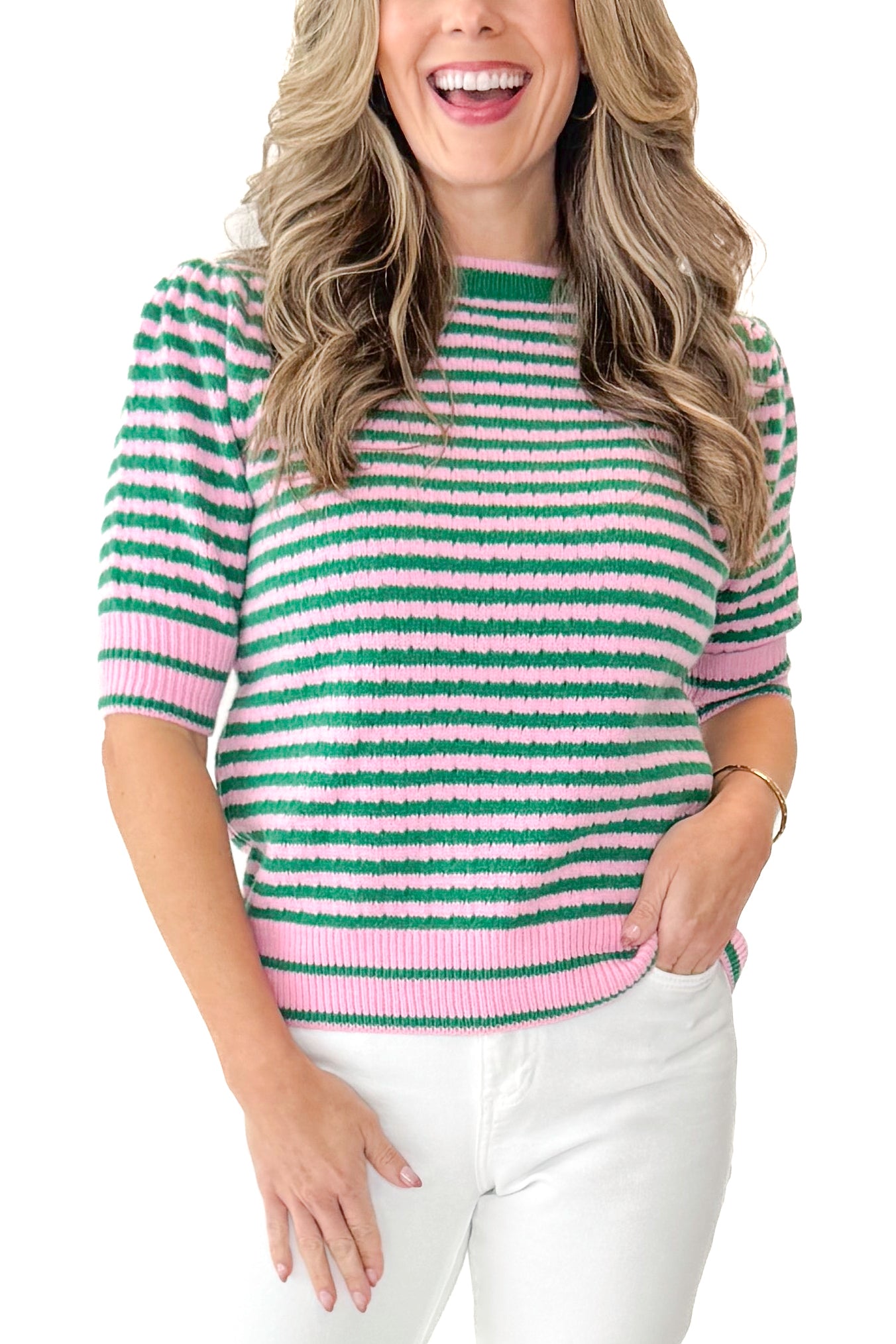 Front detail view of woman wearing Green &amp; Pink Striped Short Sleeve Sweater with jeans against white studio background.