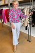 A Cut Above blue and pink floral printed sweater - full length model shot at a boutique