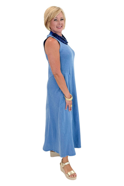 Side view of woman wearing Swagger Boutique’s Marina Waters Edge Midi Dress by Z Supply with sandals against white studio background.
