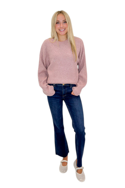 Front view of woman wearing Swagger Boutique’s Mauve Ribbed sweater with jeans against white studio background.