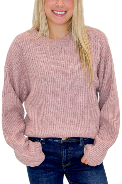 Front detail view of woman wearing Swagger Boutique’s Mauve Ribbed sweater with jeans against white studio background.