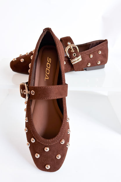 Mayhap- Brown Studded Flats against white background.