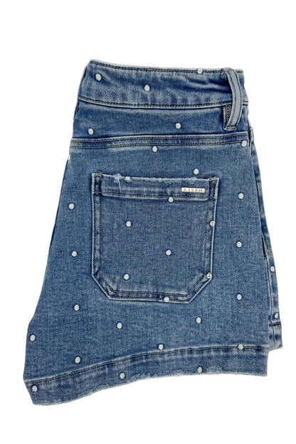 Swagger Boutique’s Medium Wash Polka Dot Denim Shorts against white studio background.