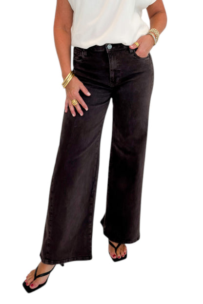 Front view of woman wearing Swagger Boutique’s Meg Wide Leg Jeans in Chocolate by Kut from the Kloth with top against white studio background.