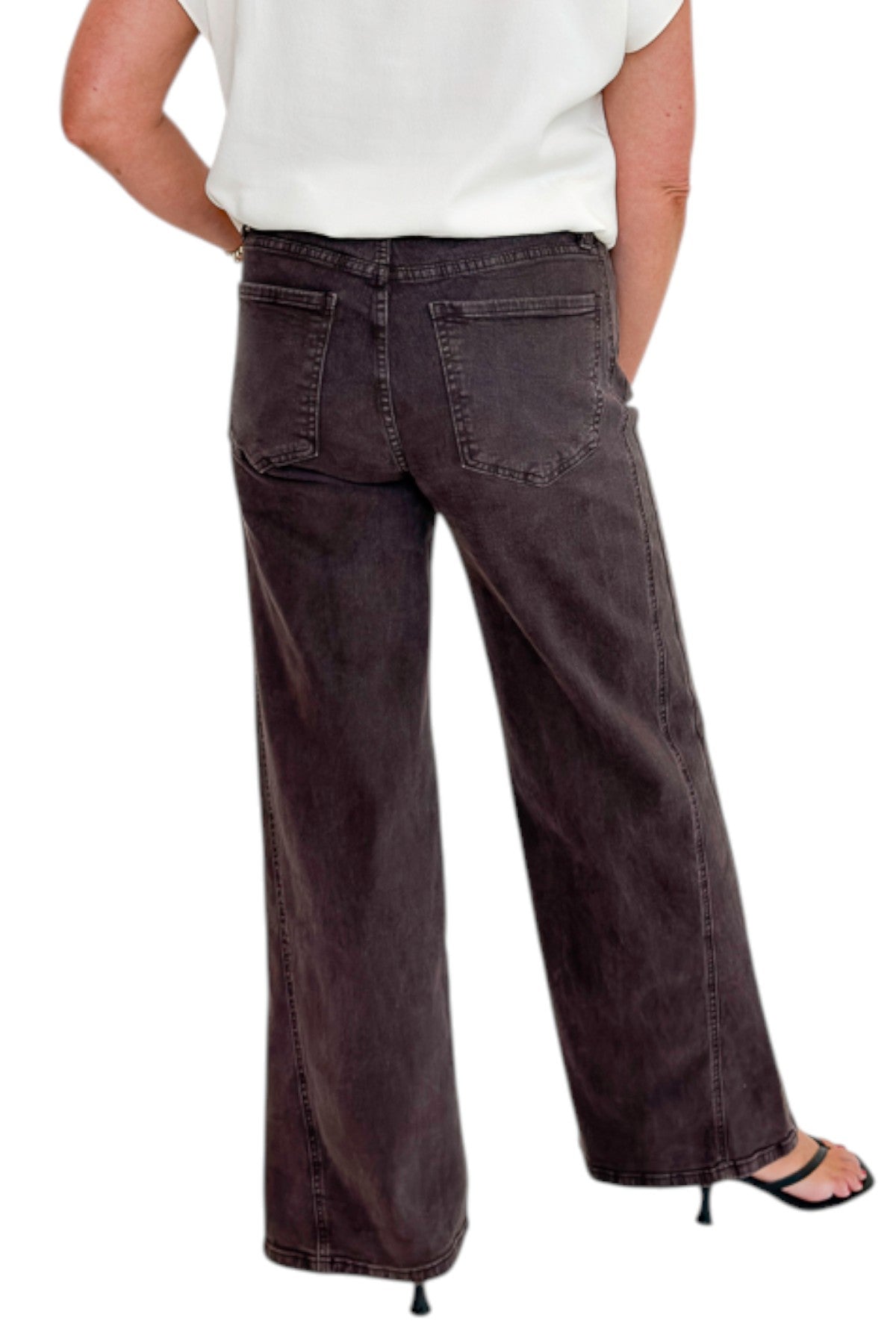 Back view of woman wearing Swagger Boutique’s Meg Wide Leg Jeans in Chocolate by Kut from the Kloth with top against white studio background.