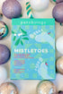 MistleToes Holiday Kit 2026 against holiday background.