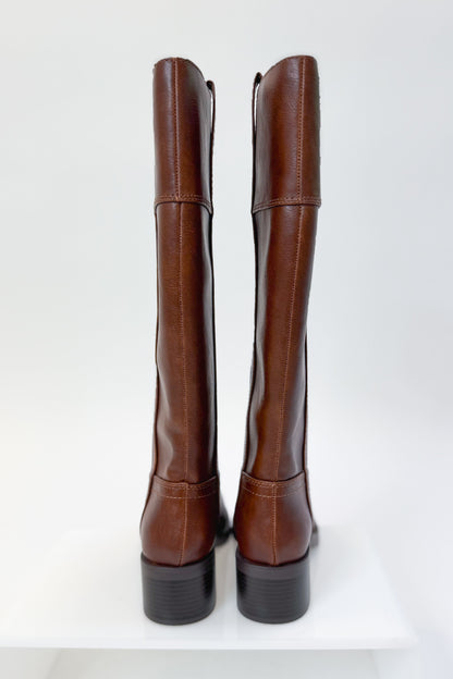 Mizell- Brown Tall Boots against white studio background back view.