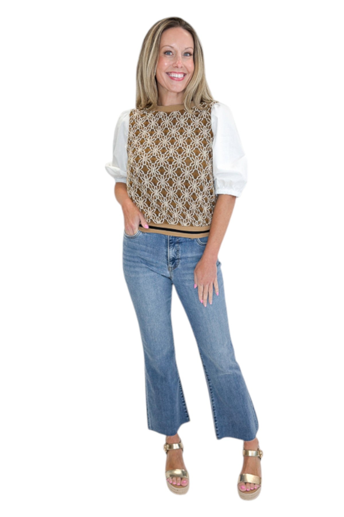 Front view of woman wearing Swagger Boutique’s Mocha Floral Crocheted Contrast Sleeve Top with jeans against white studio background.