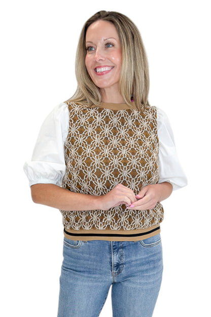 Front view of woman wearing Swagger Boutique’s Mocha Floral Crocheted Contrast Sleeve Top with jeans against white studio background.