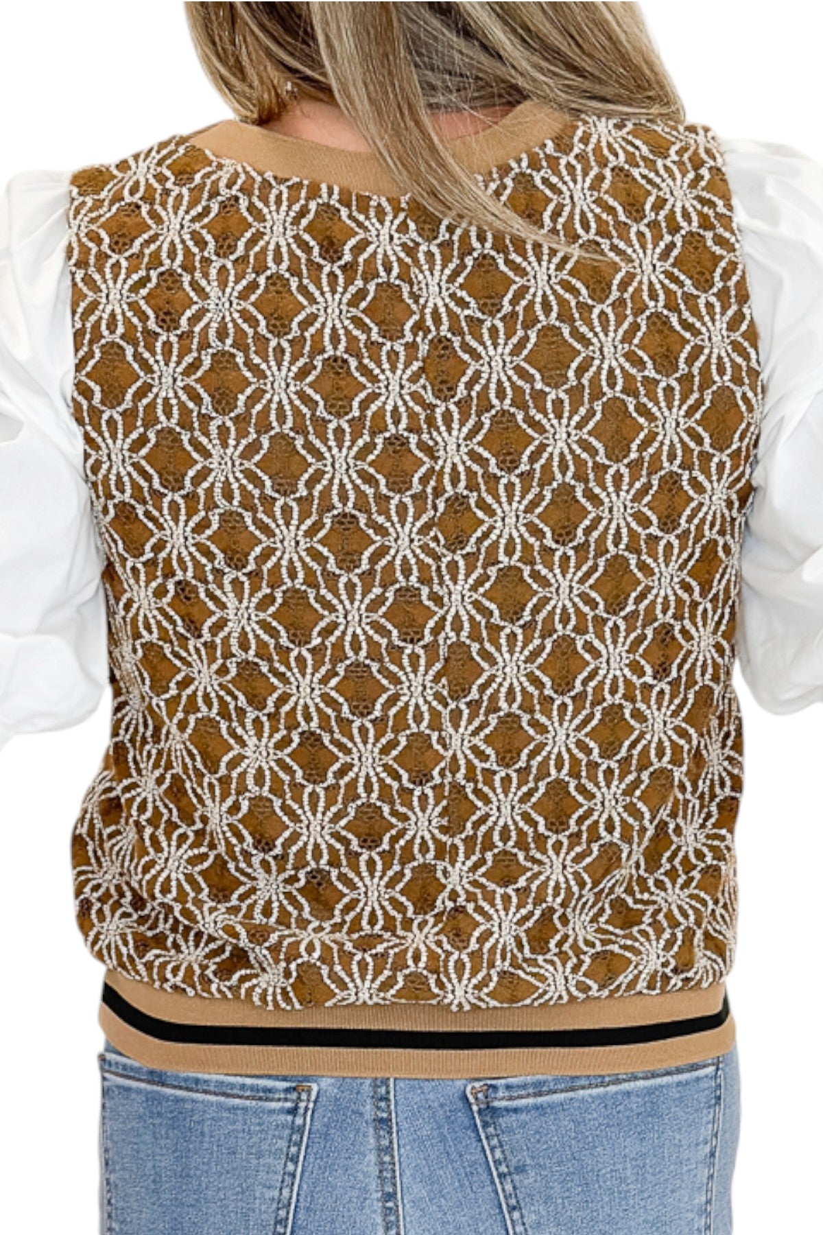 Back detail view of woman wearing Swagger Boutique’s Mocha Floral Crocheted Contrast Sleeve Top with jeans against white studio background.