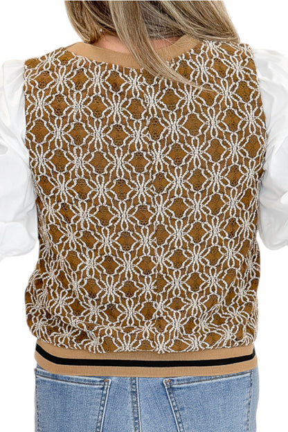 Back detail view of woman wearing Swagger Boutique’s Mocha Floral Crocheted Contrast Sleeve Top with jeans against white studio background.