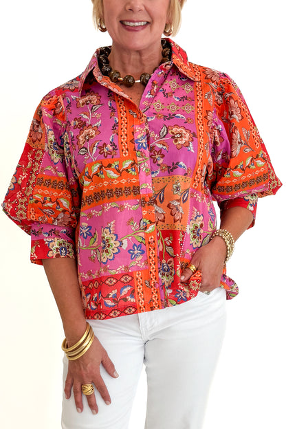 Front detail view of woman wearing Swagger Boutique’s Multi Floral Patchwork Top with jeans against white studio background.