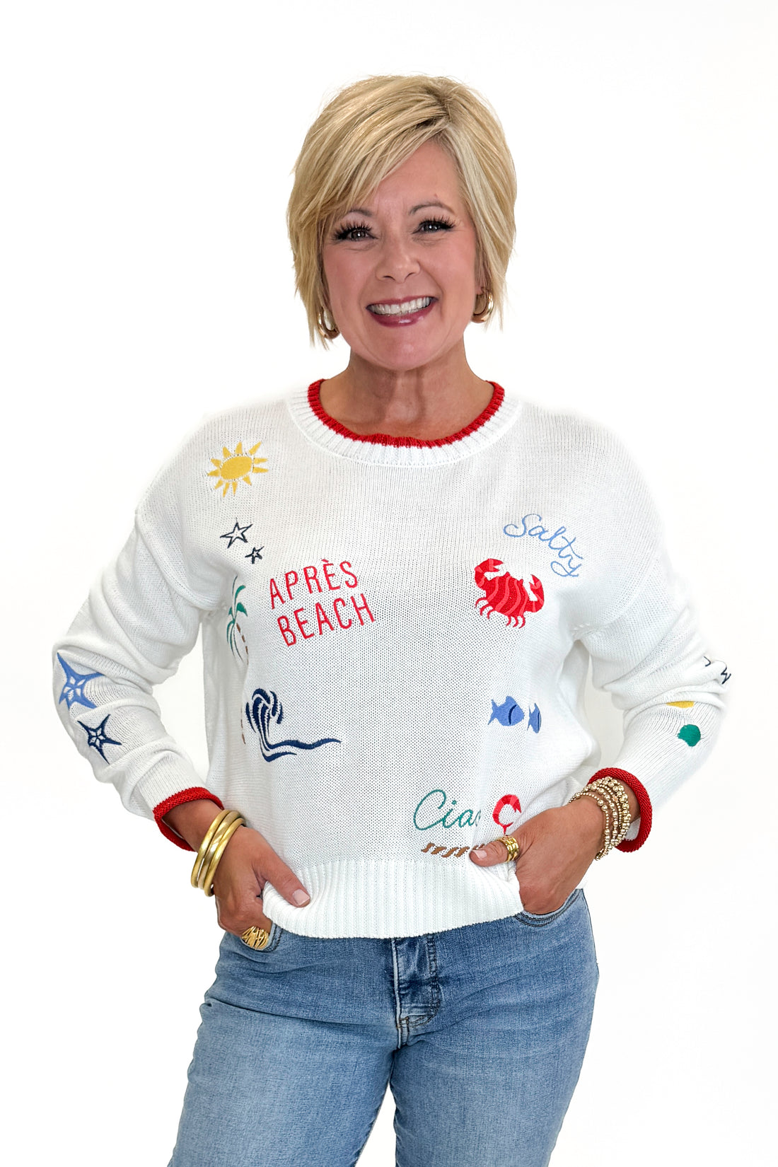 Front view of woman wearing Swagger Boutique’s Multi Seas The Day Sienna Sweater by Z Supply with jeans against white studio background.