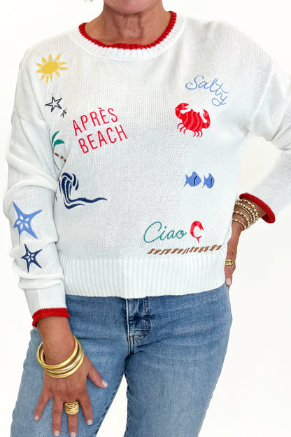 Front detail view of woman wearing Swagger Boutique’s Multi Seas The Day Sienna Sweater by Z Supply with jeans against white studio background.