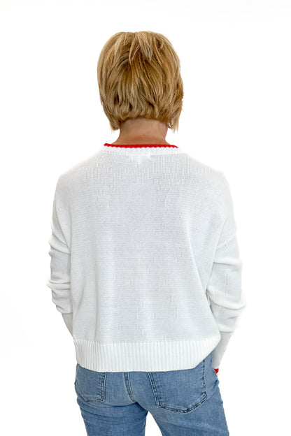 Back view of woman wearing Swagger Boutique’s Multi Seas The Day Sienna Sweater by Z Supply with jeans against white studio background.