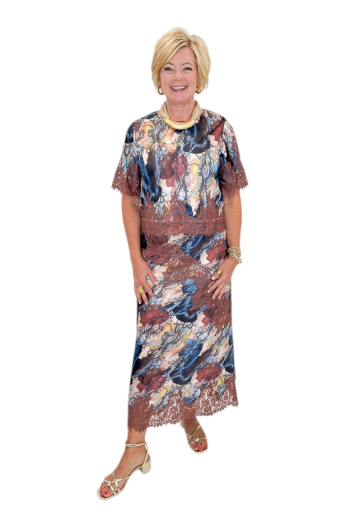 Front view of woman wearing Swagger Boutique’s Multi Snake Print Lace Trim Top with Multi Snake Print Lace Trim Midi Skirt against white studio background.